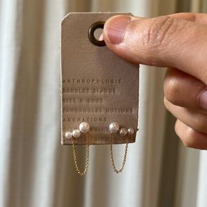 Pearls and draped gold chain earring pair.